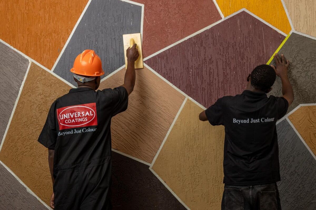Team applying decorative textured finish