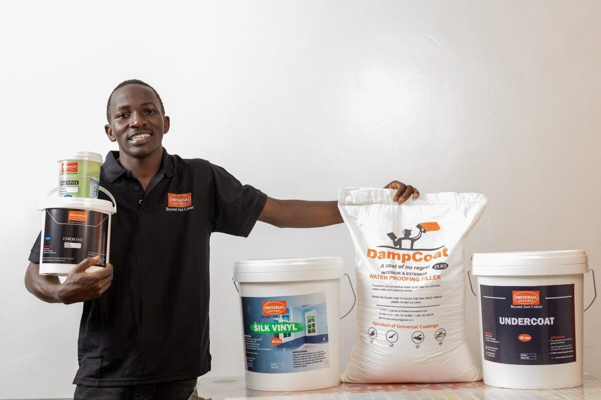 Universal Coatings team member with product range