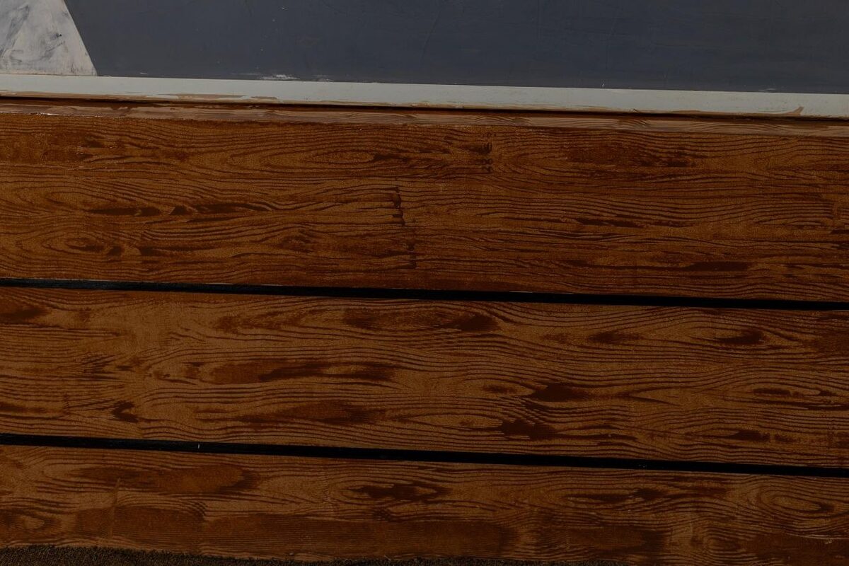 Finished wood grain textured surface